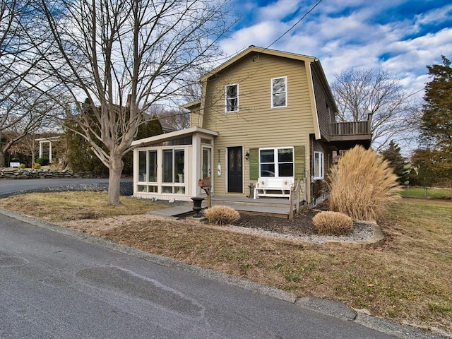 view of property with a sunroom