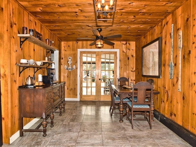 dining room featuring ceiling fan, french doors, and wood ceiling