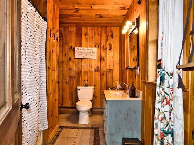 bathroom with vanity, tile patterned floors, wooden ceiling, and wood walls