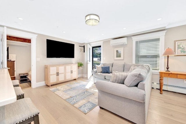600 Shirley St Unit 3, Winthrop, MA 02152 - living room with an AC wall unit, light wood-style flooring, recessed lighting, a baseboard radiator, and baseboards
