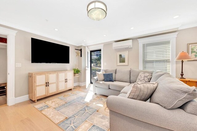 600 Shirley St Unit 3, Winthrop, MA 02152 - living room featuring an AC wall unit, crown molding, baseboards, recessed lighting, and light wood-type flooring
