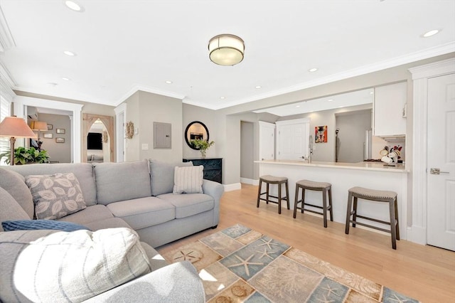 600 Shirley St Unit 3, Winthrop, MA 02152 - living room with light wood-style floors, recessed lighting, crown molding, baseboards, and electric panel