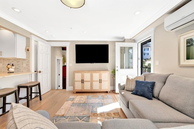 600 Shirley St Unit 3, Winthrop, MA 02152 - living area with an AC wall unit, light wood-type flooring, recessed lighting, and ornamental molding