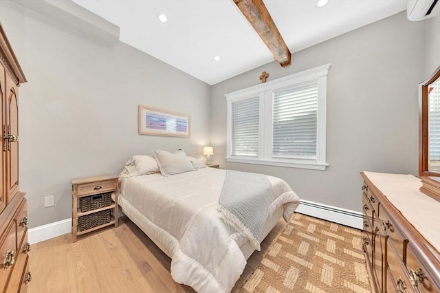 600 Shirley St Unit 3, Winthrop, MA 02152 - bedroom featuring a baseboard heating unit, an AC wall unit, beam ceiling, light wood finished floors, and recessed lighting