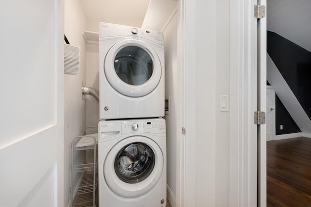26 Newport St Unit 2, Boston, MA 02125 - washroom with stacked washing machine and dryer and wood finished floors