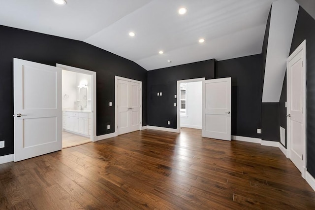 26 Newport St Unit 2, Boston, MA 02125 - unfurnished bedroom featuring lofted ceiling, wood finished floors, baseboards, connected bathroom, and recessed lighting