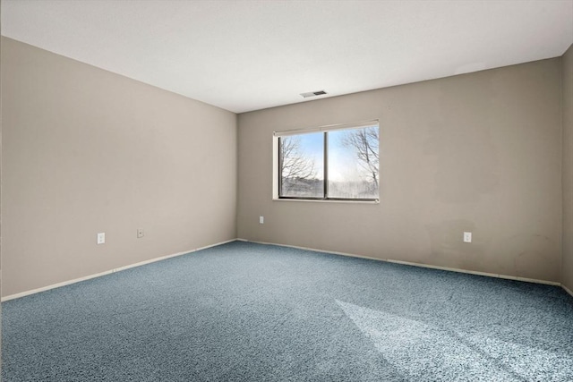 spare room featuring carpet