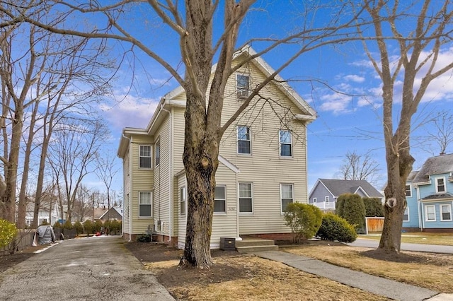 view of side of home with a residential view