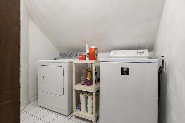 laundry area with light tile patterned floors, laundry area, and washer and dryer