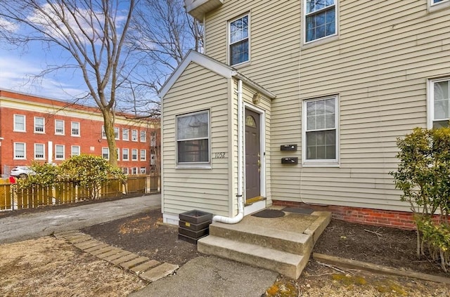 doorway to property with fence