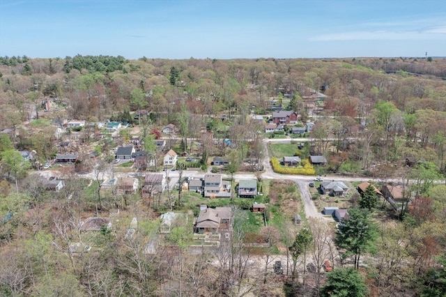 birds eye view of property with a residential view and a view of trees