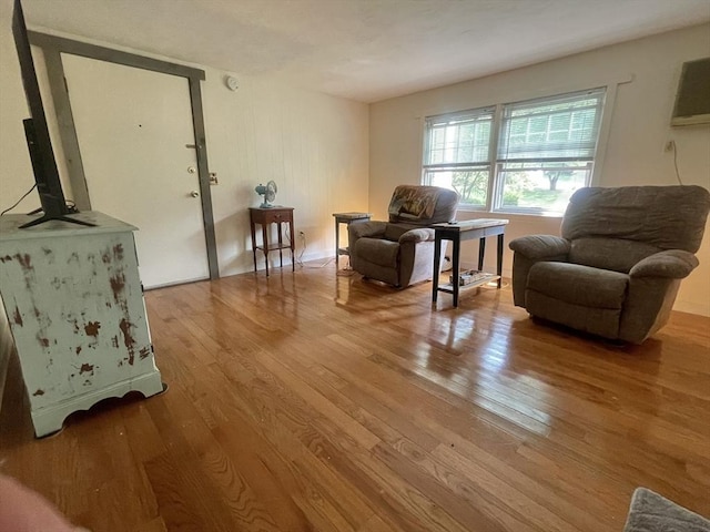 sitting room with hardwood / wood-style floors