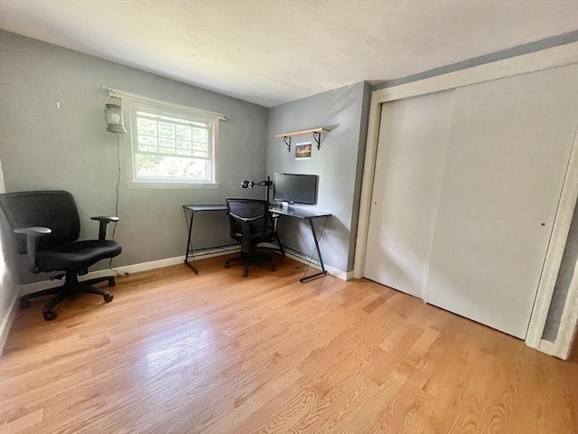 home office with light wood-type flooring