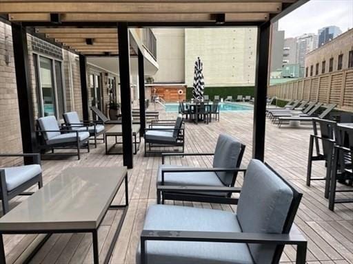 151 Tremont St Unit 9N, Boston, MA 02111 - wooden deck featuring an outdoor hangout area