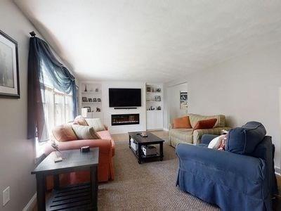 15 Northside Ct, Haverhill, MA 01830 - living room featuring built in features and a glass covered fireplace