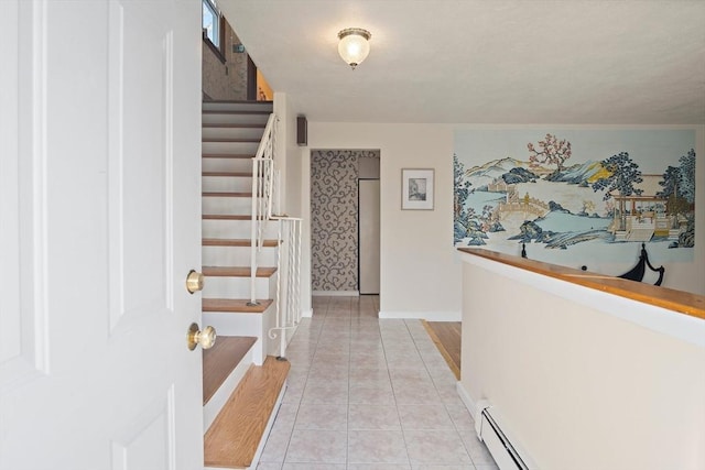 tiled foyer featuring baseboard heating