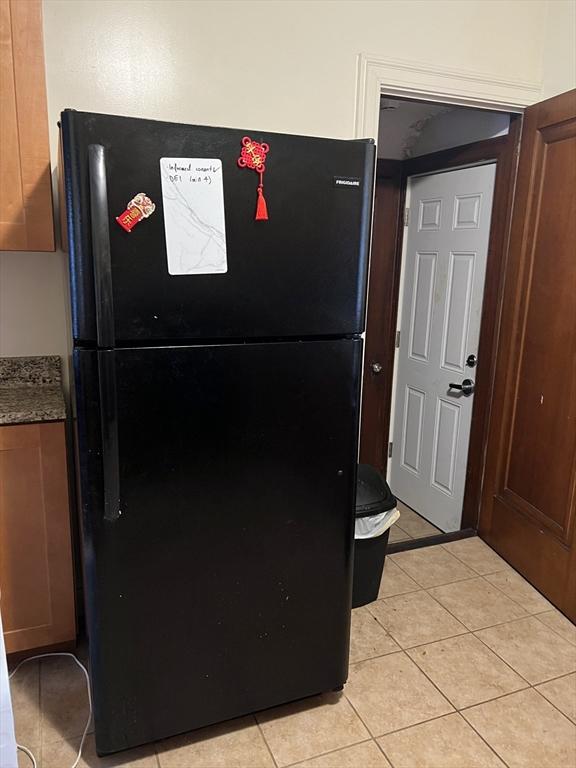 interior details featuring black fridge