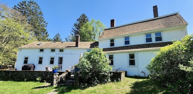 5 Putnam Hill Rd, Sutton, MA 01590 - back of property featuring a chimney and a lawn