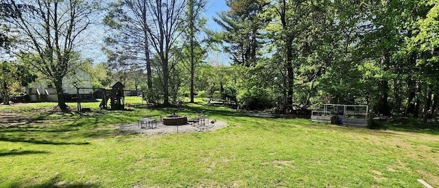 5 Putnam Hill Rd, Sutton, MA 01590 - view of green lawn featuring a fire pit and a vegetable garden