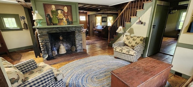 5 Putnam Hill Rd, Sutton, MA 01590 - living area with plenty of natural light, stairway, wood finished floors, and a stone fireplace