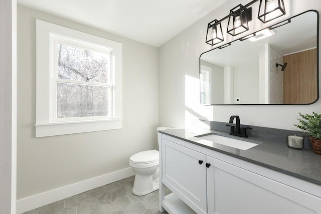 bathroom featuring tile patterned floors, vanity, and toilet