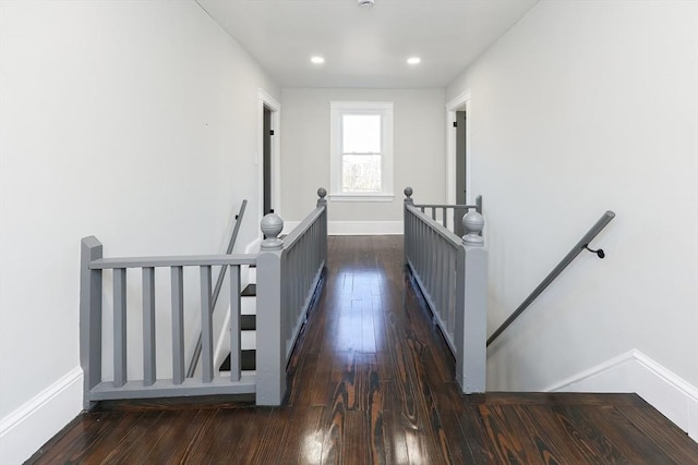 hall with dark hardwood / wood-style flooring