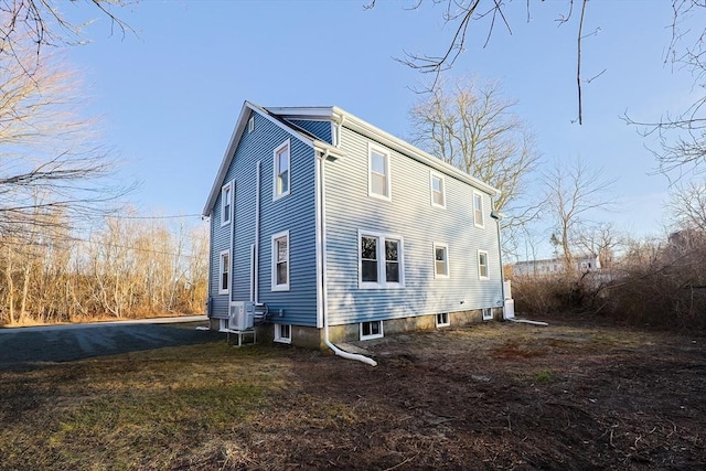 rear view of property featuring central air condition unit