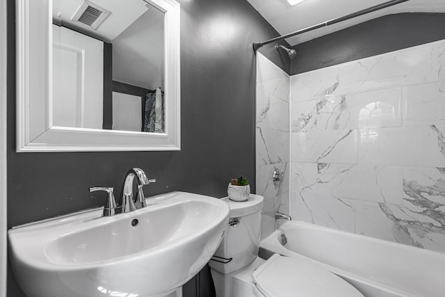 bathroom featuring a sink, bathing tub / shower combination, toilet, and visible vents