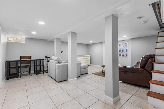 living room with light tile patterned floors, stairs, baseboards, and recessed lighting