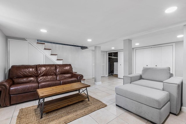 living area featuring stairway, baseboards, light tile patterned flooring, and recessed lighting