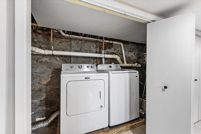 laundry area with laundry area and independent washer and dryer
