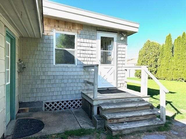entrance to property with a yard