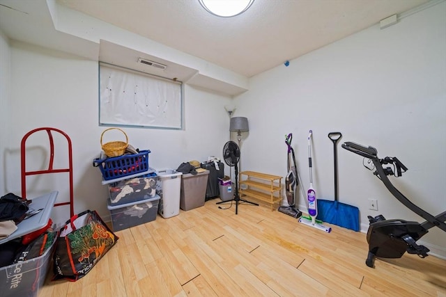 workout area featuring wood finished floors