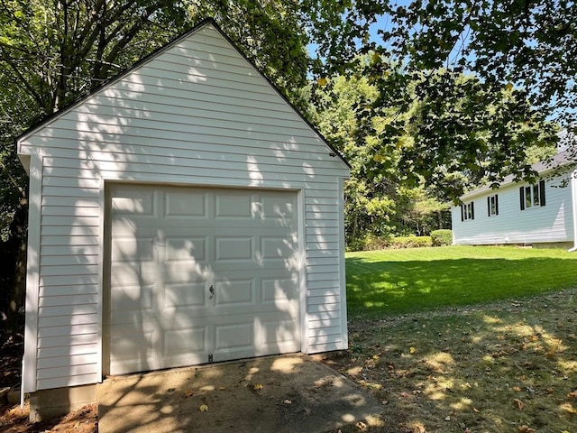 garage featuring a yard