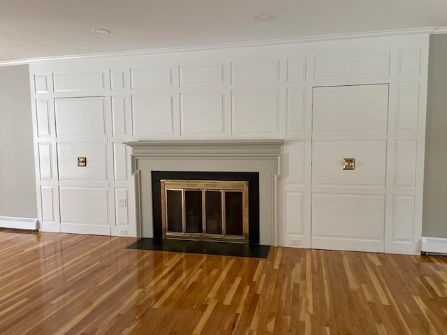 details featuring crown molding, hardwood / wood-style floors, and a baseboard radiator