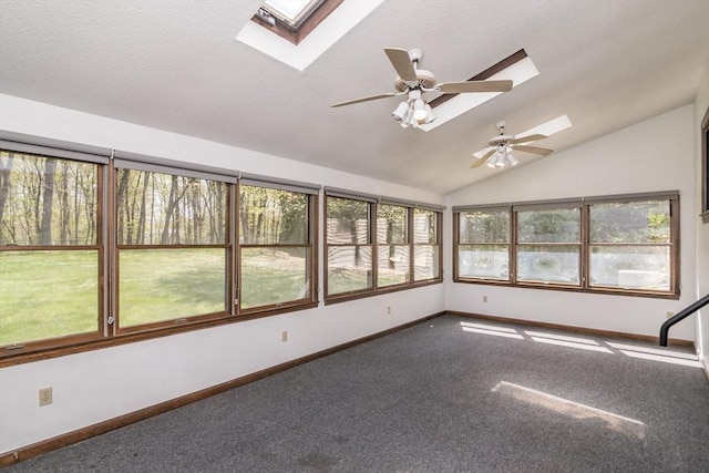 unfurnished sunroom featuring a skylight