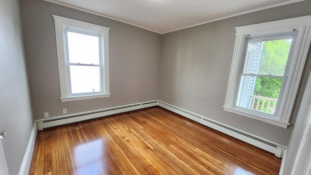 97-99 Blaisdell St Unit 2, Haverhill, MA 01832 - unfurnished room with baseboard heating, healthy amount of natural light, and ornamental molding