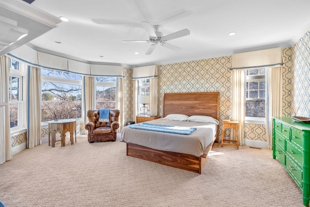 bedroom featuring ornamental molding, light carpet, and ceiling fan