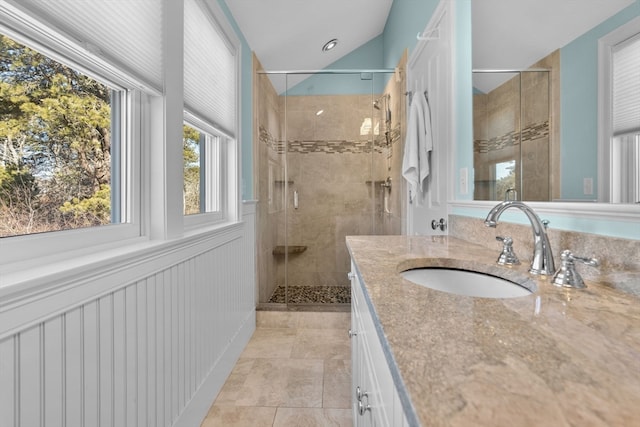 bathroom featuring tile patterned floors, vanity, and an enclosed shower