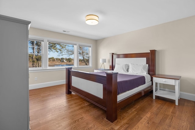 bedroom with hardwood / wood-style floors