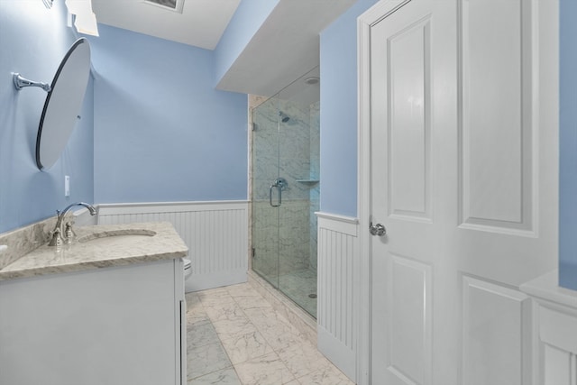 bathroom with vanity, walk in shower, toilet, and tile patterned floors