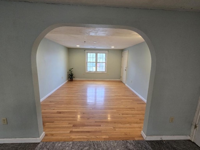 spare room featuring light wood-type flooring