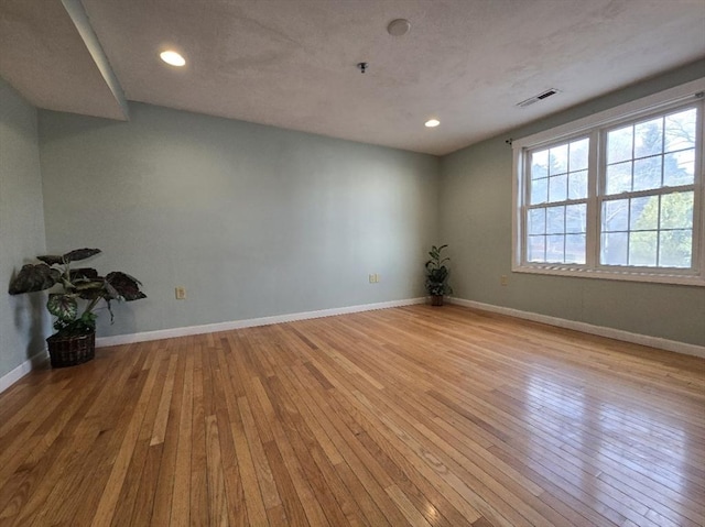 empty room with light wood-type flooring