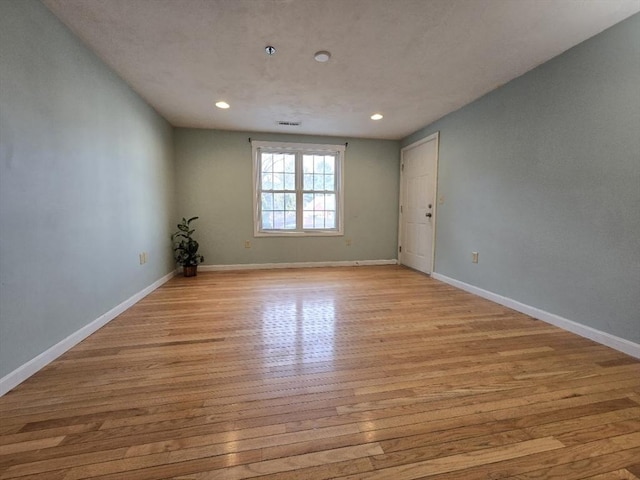 unfurnished room featuring light hardwood / wood-style floors