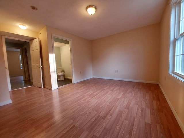 spare room featuring hardwood / wood-style floors