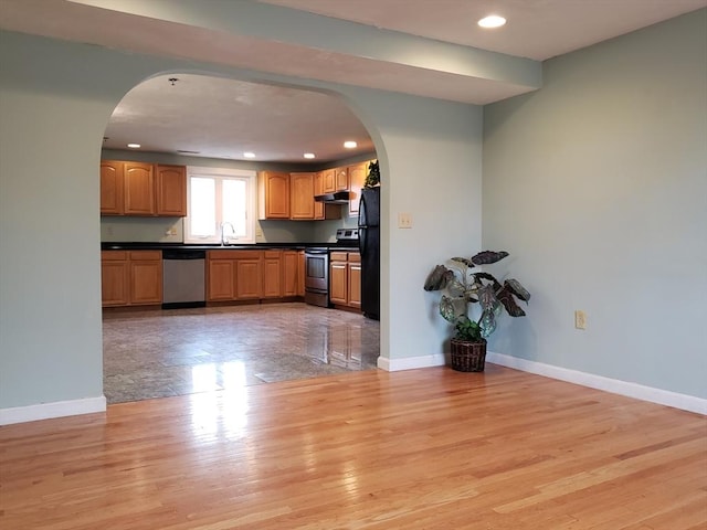 kitchen featuring sink, stainless steel appliances, and light hardwood / wood-style flooring