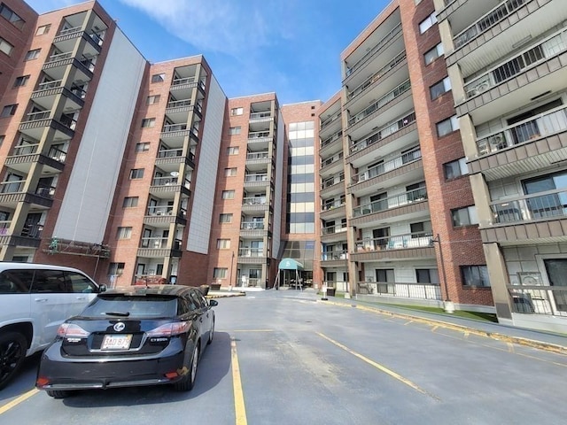 90 Quincy Shore Dr Unit 303, Quincy, MA 02171 - view of apartment building / complex with uncovered parking