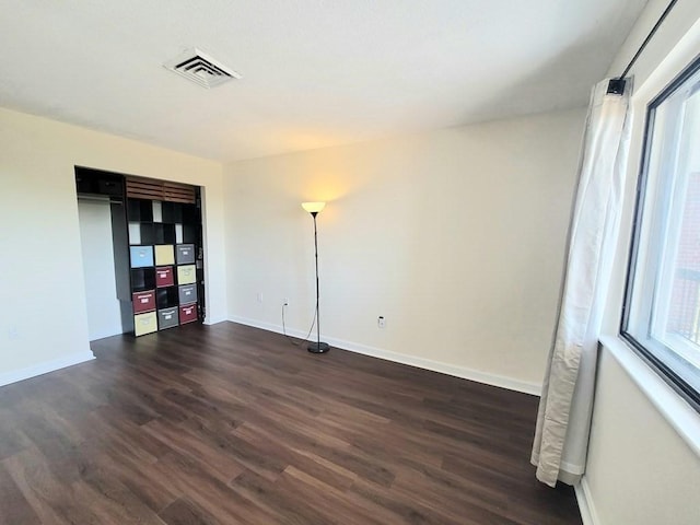 90 Quincy Shore Dr Unit 303, Quincy, MA 02171 - empty room with dark wood-type flooring
