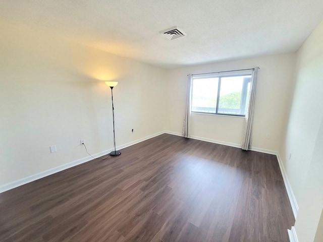 90 Quincy Shore Dr Unit 303, Quincy, MA 02171 - empty room with dark wood-type flooring and baseboards