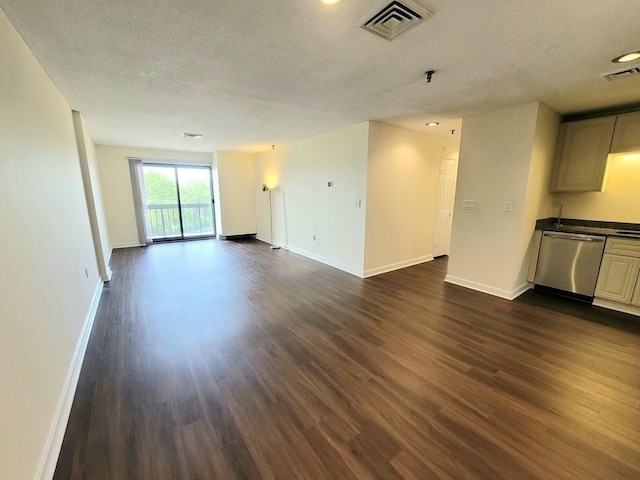 90 Quincy Shore Dr Unit 303, Quincy, MA 02171 - unfurnished living room with dark wood finished floors and a textured ceiling